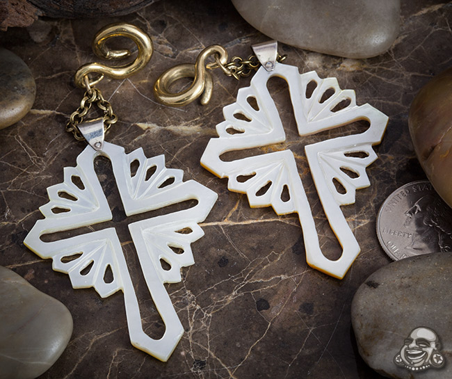 solid brass loops with mother of pearl crosses hanging from them