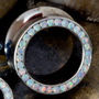 Opal gemmed eyelet