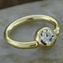 Gold plated captive with clear CZ gem