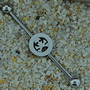 Skull and crossbones  industrial barbell