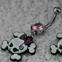 Smirking punk girl skull dangle navel